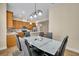 Dining room with modern table and chairs adjacent to the kitchen area at 1436 Lobelia Dr, Lake Mary, FL 32746
