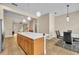 Open kitchen with a large island that overlooks the dining and living areas at 1436 Lobelia Dr, Lake Mary, FL 32746