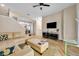 Open-concept living room featuring tile flooring, a sectional couch, and modern decor at 1436 Lobelia Dr, Lake Mary, FL 32746