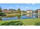 A beautiful community pond with a water fountain and lush greenery at 1436 Lobelia Dr, Lake Mary, FL 32746