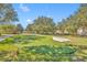 Enjoy the putting green nestled within manicured landscaping at 1436 Lobelia Dr, Lake Mary, FL 32746