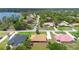An aerial view displays the home's location within a neighborhood with mature trees and well-maintained lawns at 1439 Waterview Dr, Deltona, FL 32738