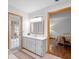 Bright bathroom features a vanity with a mirror and view to bedroom at 1439 Waterview Dr, Deltona, FL 32738