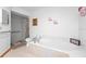 Bright bathroom features a tub, shower, toilet, and tiled flooring at 1439 Waterview Dr, Deltona, FL 32738
