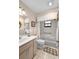 Cozy bathroom features a vanity, tub/shower combo, and neutral tones at 1439 Waterview Dr, Deltona, FL 32738
