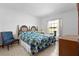 Inviting bedroom with a decorative bed frame and large window at 1439 Waterview Dr, Deltona, FL 32738