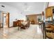 Bright dining area featuring vaulted ceilings, tile floors, a brick accent wall, and views to the backyard at 1439 Waterview Dr, Deltona, FL 32738
