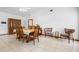 Open dining area featuring vaulted ceilings, tile floors, neutral paint, and traditional furnishings at 1439 Waterview Dr, Deltona, FL 32738