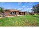 Beautiful single-story brick home with a well-maintained lawn and garden at 1439 Waterview Dr, Deltona, FL 32738