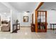 Open foyer with tile floors, wooden accents, and a glimpse of other living spaces at 1439 Waterview Dr, Deltona, FL 32738