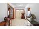 Inviting foyer featuring tile flooring, decorative accents, and a beautiful front door at 1439 Waterview Dr, Deltona, FL 32738
