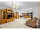 Open-concept living area with tile floors, lots of natural light, and access to other rooms at 1439 Waterview Dr, Deltona, FL 32738