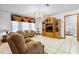 Bright and cozy living room with classic furniture and a doorway to the laundry room at 1439 Waterview Dr, Deltona, FL 32738