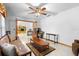 Open living room features neutral tile flooring and a seamless flow to adjoining rooms at 1439 Waterview Dr, Deltona, FL 32738