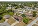 Aerial view of the house in a residential neighborhood with mature trees and well-maintained yards at 1440 Portola Ave, Deltona, FL 32738