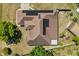 Aerial view of house with solar panels, lush landscaping, and a fenced yard at 1440 Portola Ave, Deltona, FL 32738