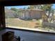 View of backyard from the screened patio showcasing the yard and outbuilding at 1440 Portola Ave, Deltona, FL 32738