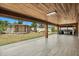 Large backyard featuring a covered patio, and a storage building at 1440 Portola Ave, Deltona, FL 32738