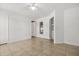 This bedroom features tile flooring, and multiple doors at 1440 Portola Ave, Deltona, FL 32738