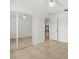 Bedroom boasts mirrored closet doors and tile floors at 1440 Portola Ave, Deltona, FL 32738