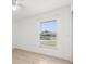 Bright bedroom features tile flooring, white walls, and window with blinds at 1440 Portola Ave, Deltona, FL 32738