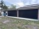 Exterior view of home featuring screened patio and well-maintained yard at 1440 Portola Ave, Deltona, FL 32738
