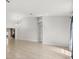 Bright living room boasts tile flooring, neutral walls, and modern chandelier at 1440 Portola Ave, Deltona, FL 32738