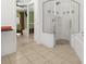 Spacious main bathroom featuring glass shower, soaking tub, and access to main bedroom at 1440 Portola Ave, Deltona, FL 32738