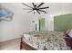 Bright main bedroom with a ceiling fan, wall decor and access to a connected bathroom at 1440 Portola Ave, Deltona, FL 32738
