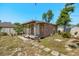 Exterior of brick storage building with small porch, steps, and pathway at 1440 Portola Ave, Deltona, FL 32738