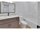 Bathroom with gray vanity, marble countertop, modern mirror, tile floors, tub and shower combo at 1450 Benham Ave, Orange City, FL 32763