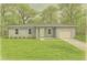 Charming single-story home featuring a well-maintained lawn and mature trees at 1450 Benham Ave, Orange City, FL 32763