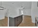 Kitchen island with granite countertops, cabinetry, and stainless steel appliances at 1450 Benham Ave, Orange City, FL 32763