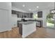 Spacious kitchen features granite countertops, modern cabinetry and stainless steel appliances at 1450 Benham Ave, Orange City, FL 32763