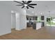 Bright, open-concept living space flows to the kitchen, with modern finishes and fixtures at 1450 Benham Ave, Orange City, FL 32763