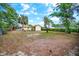 Large backyard showcasing a charming shed and plenty of open space at 1511 Jack St, Tavares, FL 32778