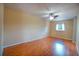 Bonus room featuring wood floors, a window, and a ceiling fan at 1511 Jack St, Tavares, FL 32778