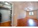 Bonus room featuring wood floors, a window, ceiling fan and storage room at 1511 Jack St, Tavares, FL 32778