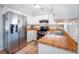 Bright kitchen featuring stainless steel appliances, butcher block countertops, and ample cabinet space at 1511 Jack St, Tavares, FL 32778