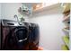 Laundry room with washer, dryer, and shelving at 1511 Jack St, Tavares, FL 32778