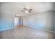 Large, inviting living area with tile floors and neutral walls, providing a versatile space at 1511 Jack St, Tavares, FL 32778