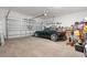 Spacious garage with a black car parked inside and ample storage space at 1550 11Th Ave, Deland, FL 32724