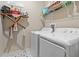 Functional laundry room equipped with a washer, dryer, and storage shelves at 1550 11Th Ave, Deland, FL 32724