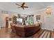Inviting living room featuring a comfortable sectional sofa, hardwood floors, and an abundance of natural light at 1550 11Th Ave, Deland, FL 32724