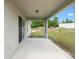 Covered patio features a ceiling light and a view of the backyard at 1601 Toledo Ave, Deltona, FL 32725
