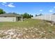 Large backyard features a white fence providing privacy and space for recreation at 1601 Toledo Ave, Deltona, FL 32725