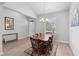 Welcoming dining area with natural light, wood table, with seamlessly access to the entry area at 1601 Toledo Ave, Deltona, FL 32725