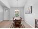 Bright dining area with neutral walls, featuring a wood table perfect for meals and entertaining at 1601 Toledo Ave, Deltona, FL 32725