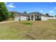 Charming home featuring a well-manicured lawn and attached two-car garage at 1601 Toledo Ave, Deltona, FL 32725