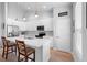 Modern kitchen featuring white cabinets, a large island, stainless steel appliances, and sleek countertops at 1601 Toledo Ave, Deltona, FL 32725